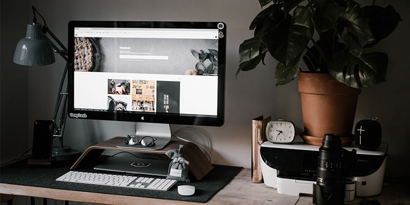 Desk with computer and plant