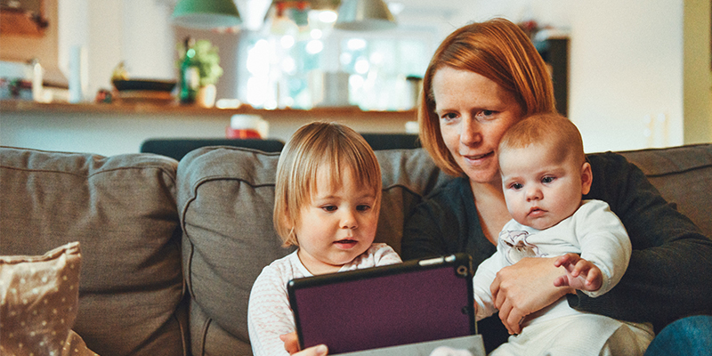 grandmother with grandchildren on couch