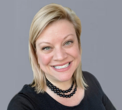 Headshot photo of Jane Talbot smiling.
