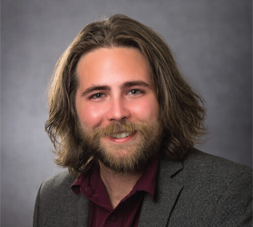 Headshot photo of Tyler Treadwell smling