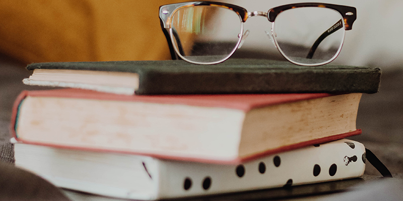 books with reading glasses